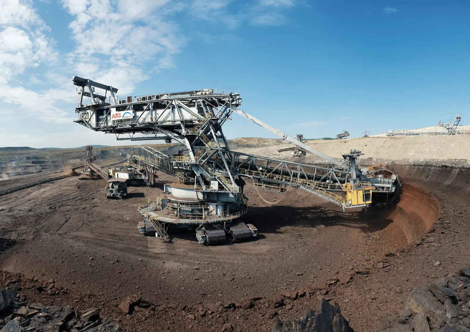 Open-pit mining site with heavy excavation machinery